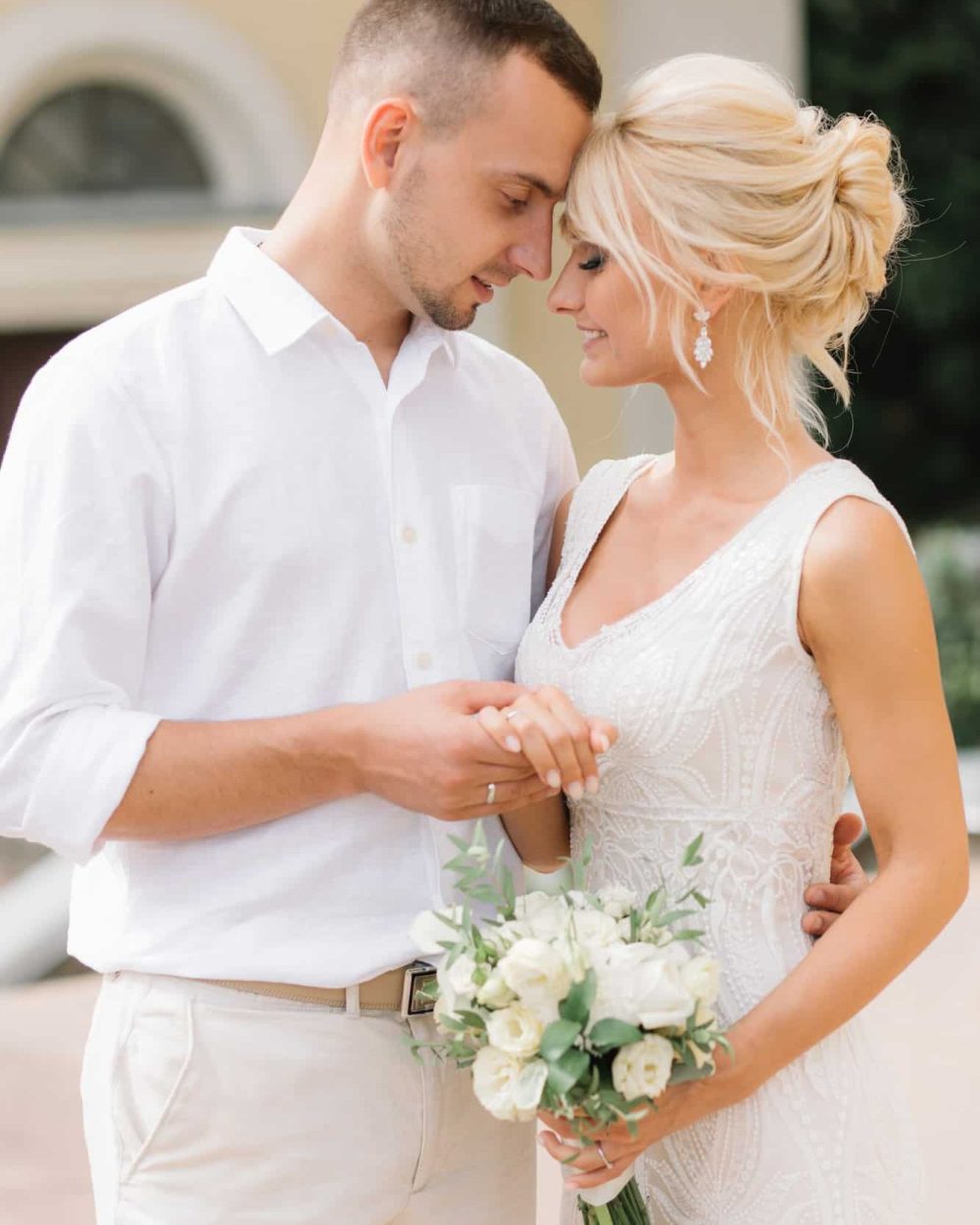 romantic-wedding-couple-embracing-outdoors-on-their-special-day.jpg